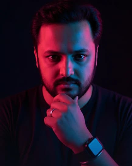 A Man with a beard, illuminated by dramatic dual-colored lighting. AI photo style example on PromptKosh